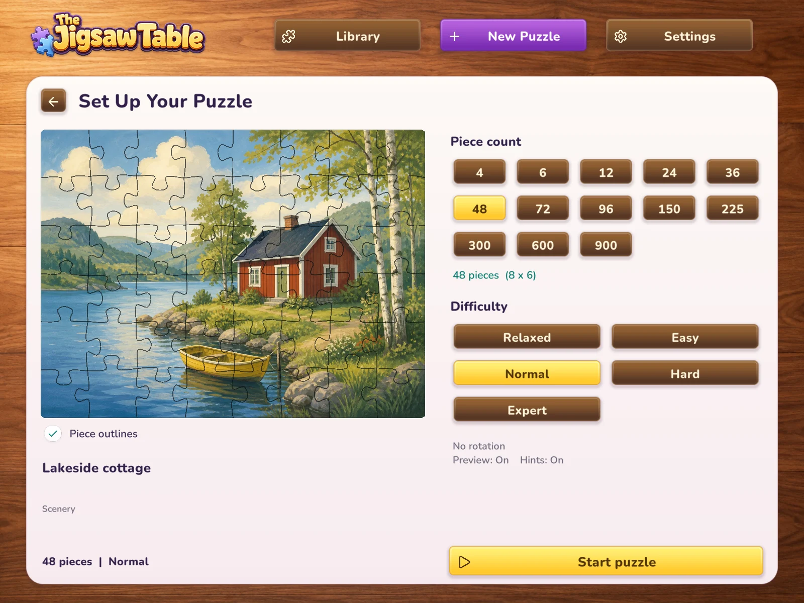 Puzzle setup with a lakeside cottage, piece-count selection and difficulty settings